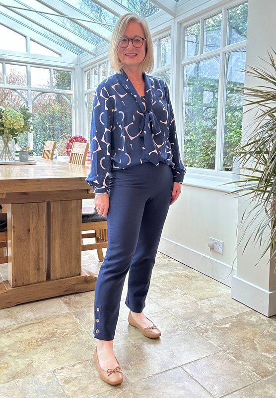 Pussy-bow blouse and navy 7/8 trousers from the new spring collection at Afibel