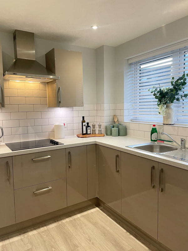 grey kitchen with white tops at churchill retirement living
