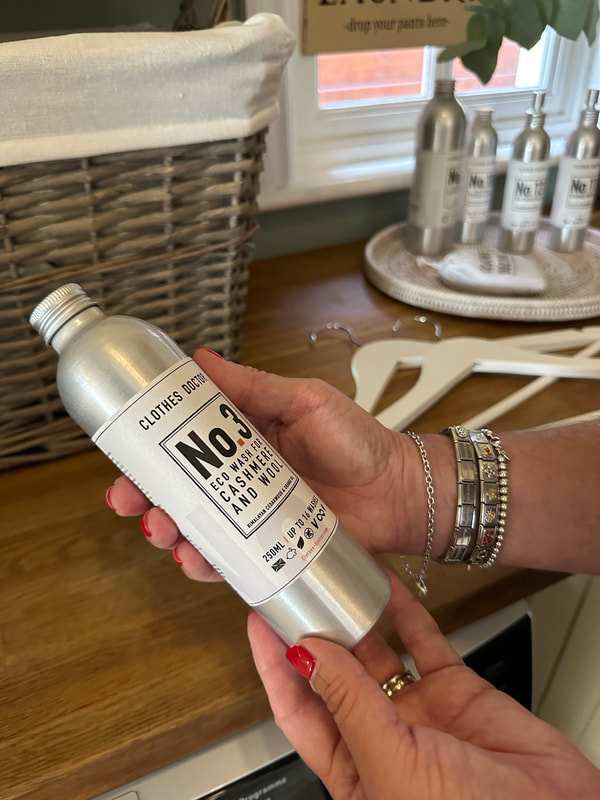 silver bottles containing eco-friendly laundry detergent