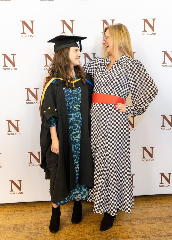 Norland graduation ceremony, mum and daughter wearing the Norland graduation robe
