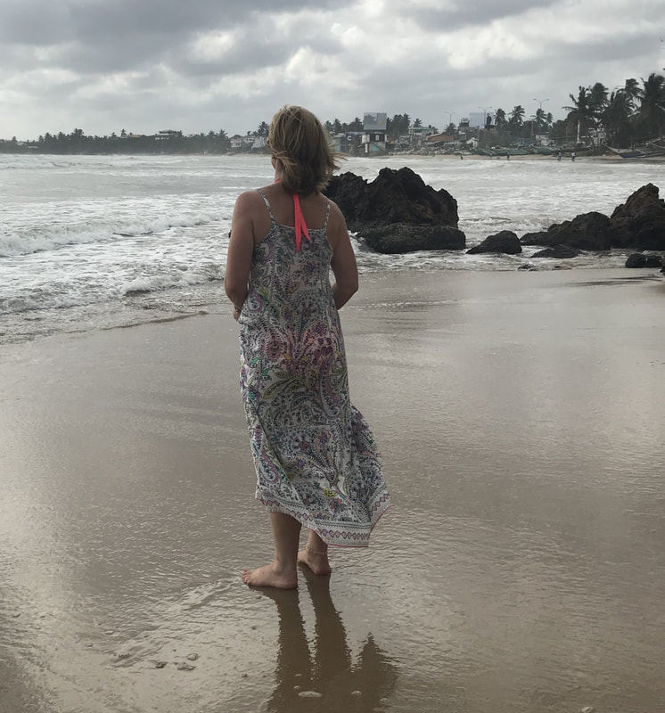 woman on beach galle fort sri lanka