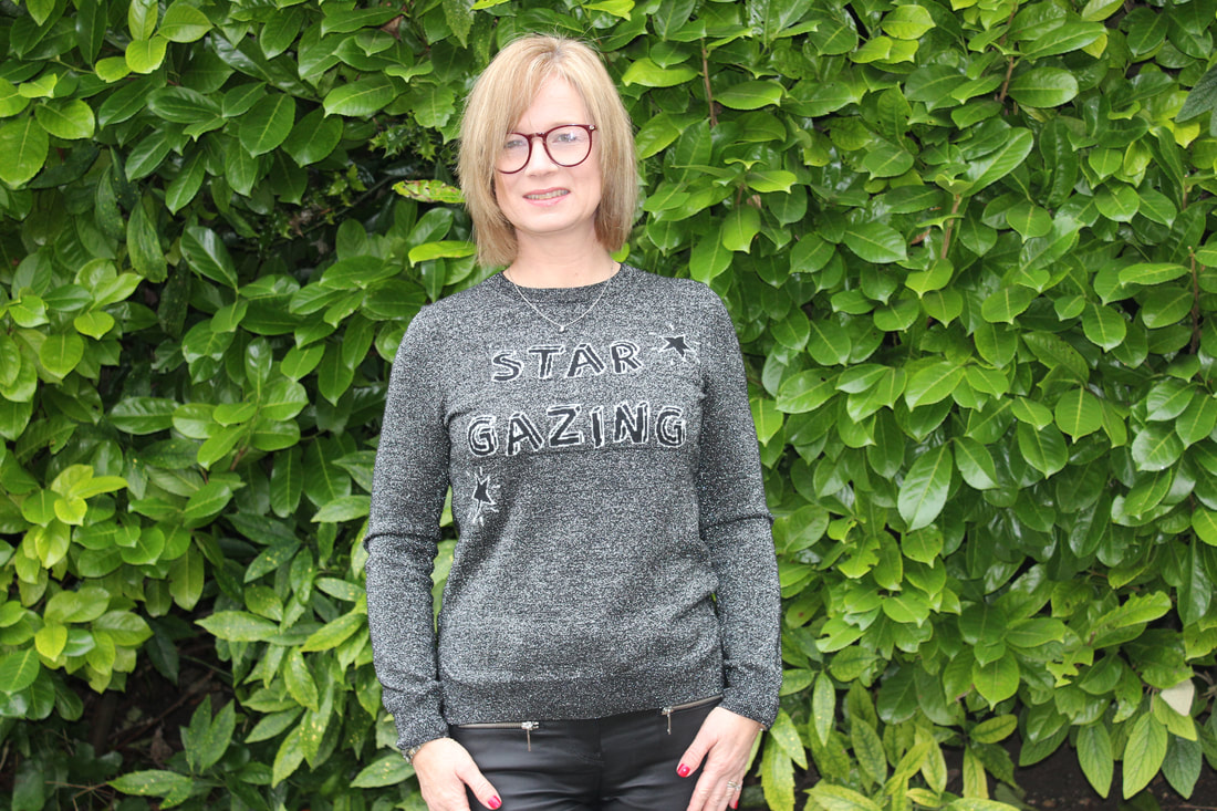 wearing star gazing jumper in black and grey 