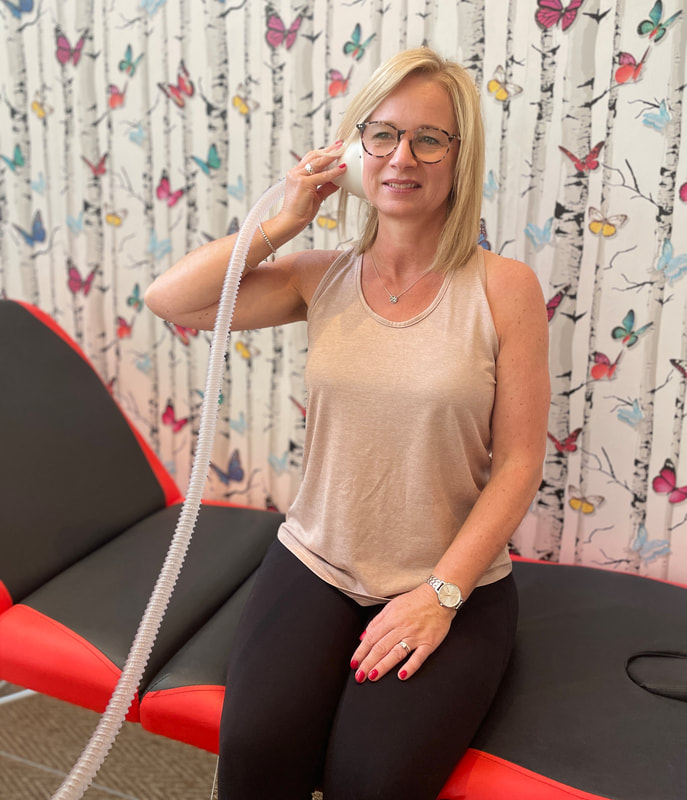 Woman sat on treatment bed | ​​Anti Ageing Treatment | Skin Rejuvenation | Nano Cellcare UK