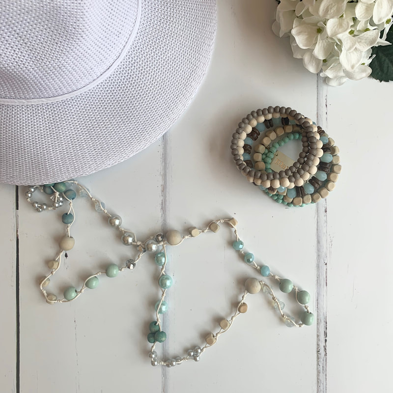 pretty bead jewellery from south africa, white hat, sustainable fashion