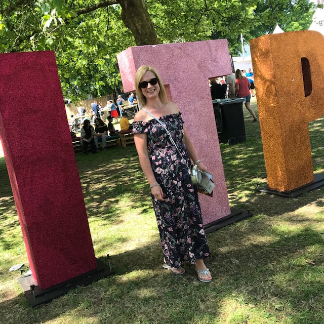 Big letters at pub in the park marlow woman wearing summer dress in the park