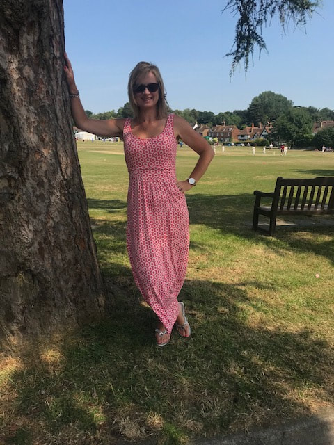 woman by tree on cricket pitch kent