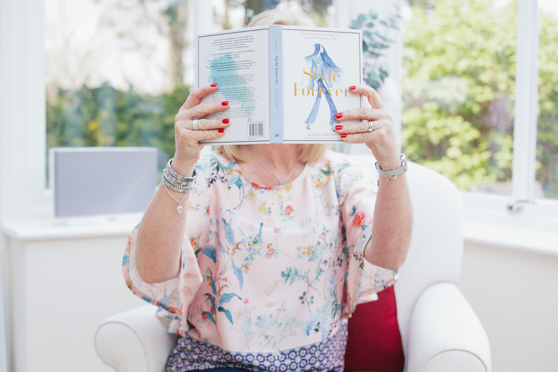 woman looking at a style book