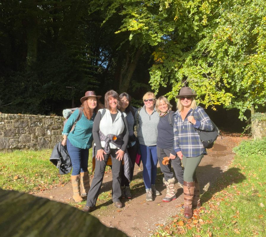 a group of 6 women walking in the wye valley during a writing retreat