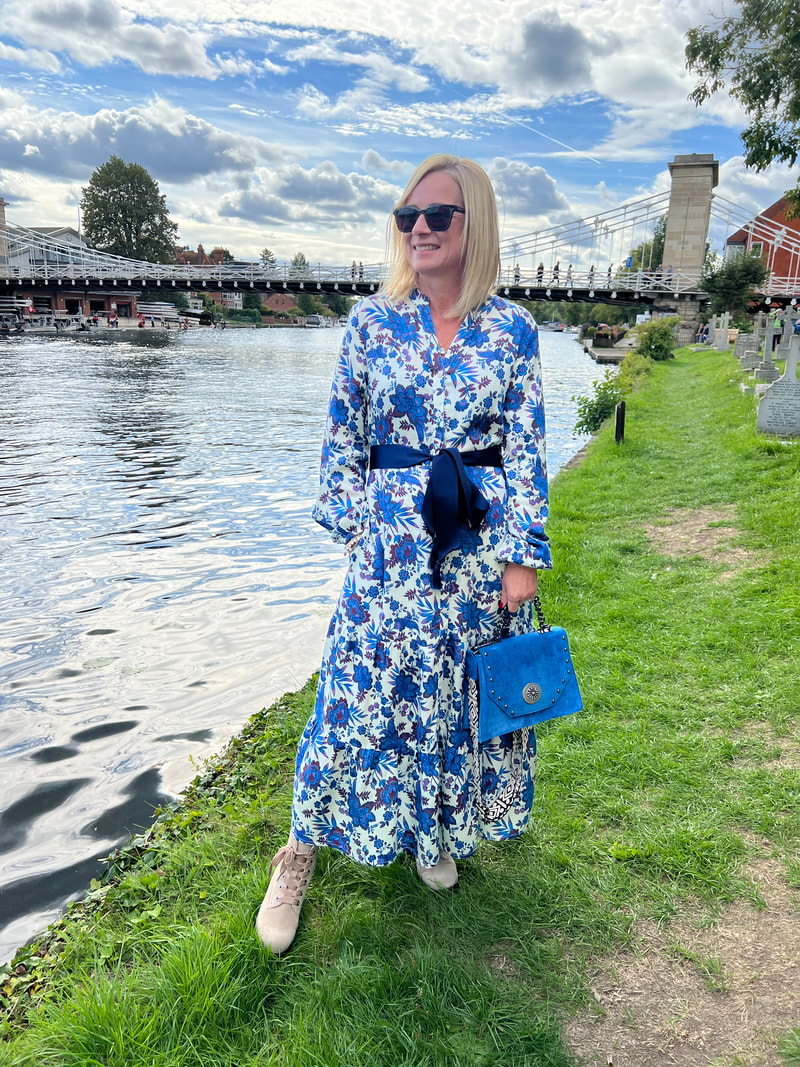Michelle in front of marlow bridge on the river thames and wearing a blue dress from Elizabeth Rose Fashion Boutique