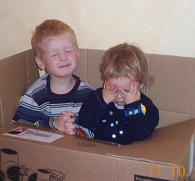 playing in a cardboard box