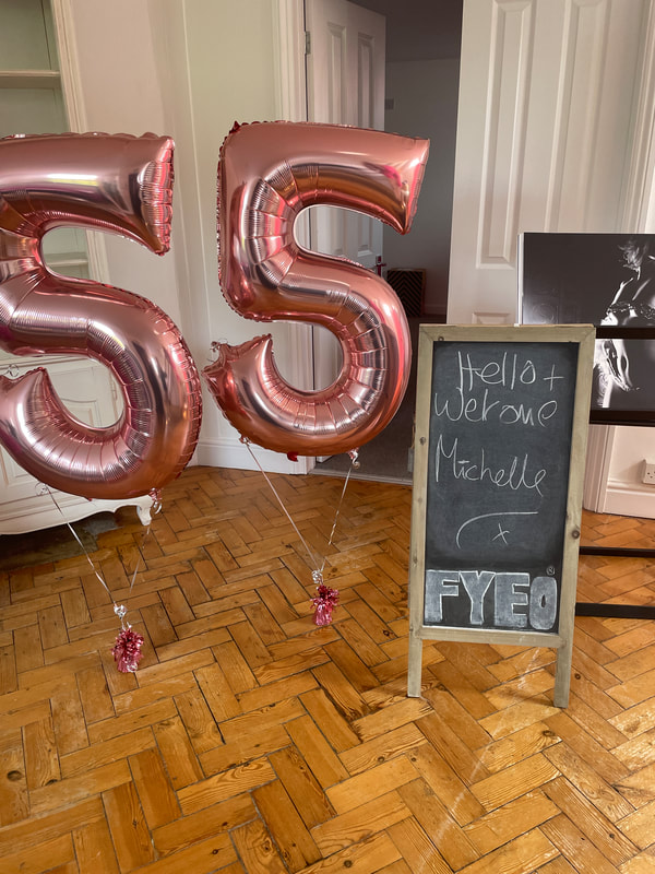 Rose gold 55 balloons for a boudoir photoshoot at FYEO - blackboard says Hello and Welcome Michelle