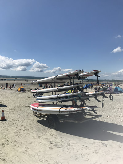 surf boards on beach uk