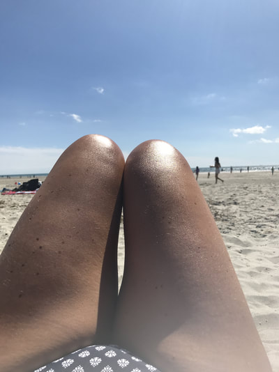 legs on sandy beach