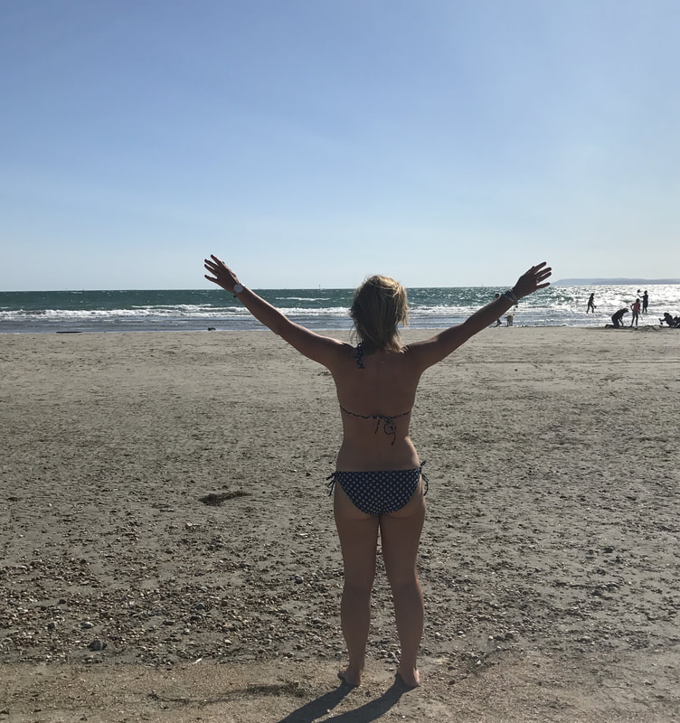 woman on beach in bikini
