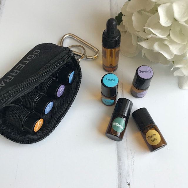 flat lay doterra essential oils for travel