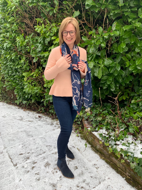 snowy picture wearing pink and spanx jeans