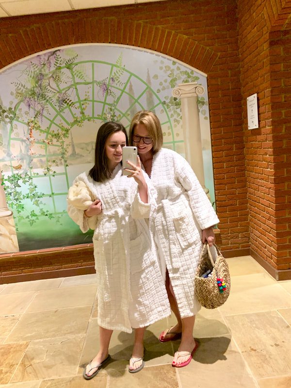 mum and daughter in white bath robes at nirvana spa in wokingham