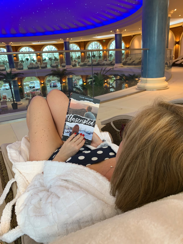 woman relaxing at nirvana spa wearing blue polka dot swimsuit