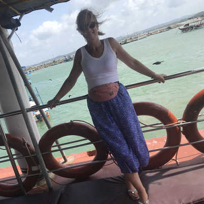 woman on boat whale watching sri lanka