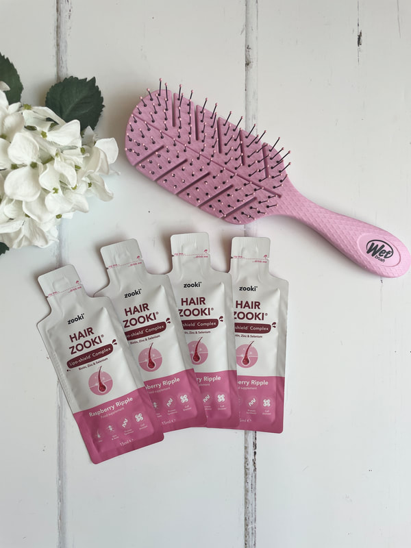 Hair Zooki supplement and pink wet brush
