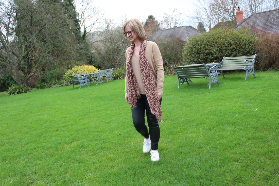 camel cashmere jumper worn with animal print scarf