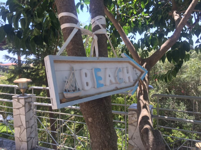 wooden beach sign in kefalonia