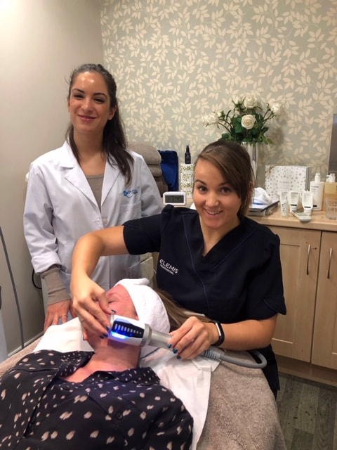 woman having an anti-ageing facial in marlow using EVA machine 