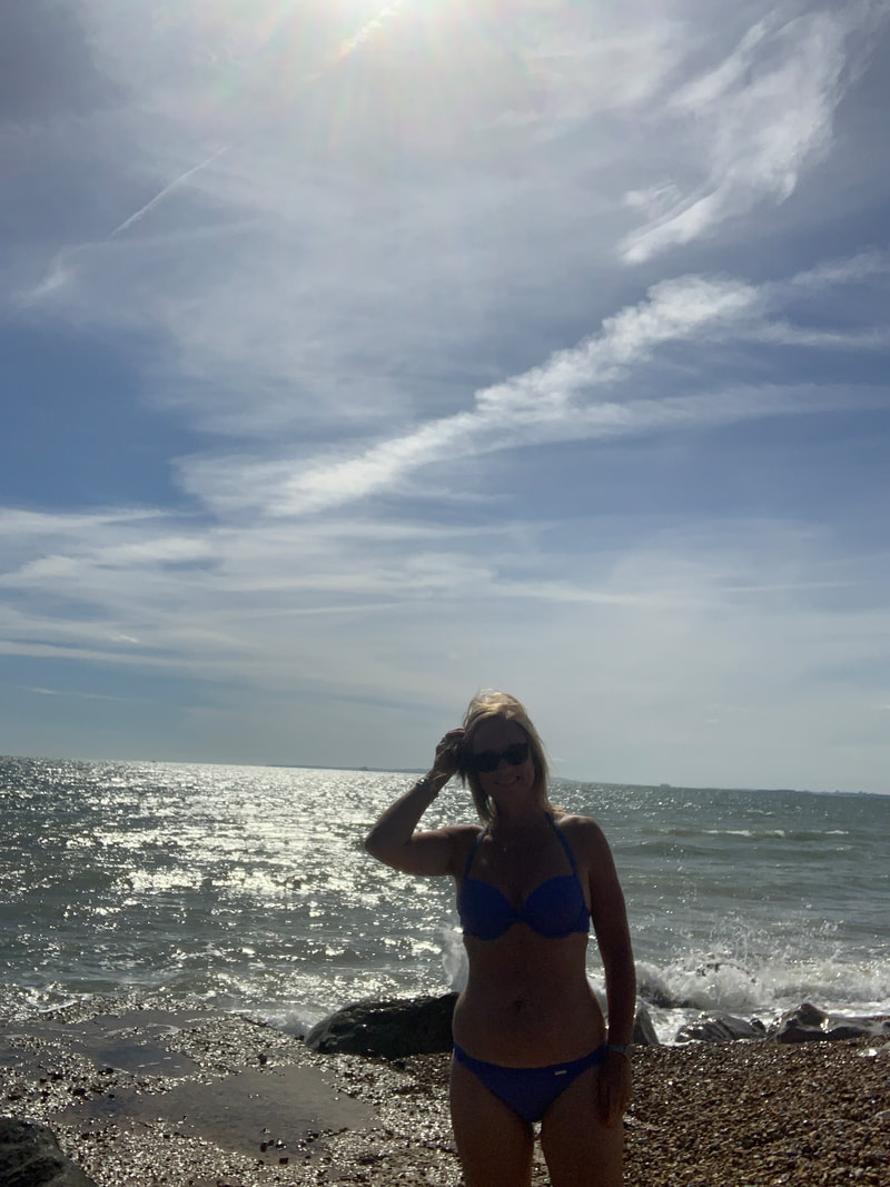 wearing a bikini on the beach at milford on sea, UK