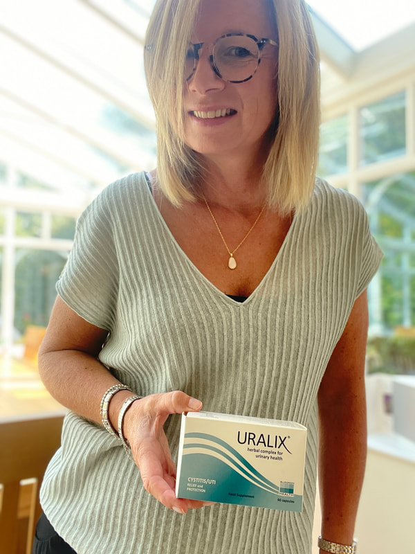 Holding a box of uralix | preventing bladder infections