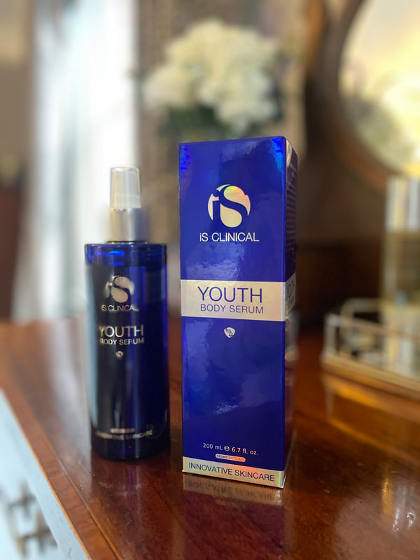 iS Clinical Youth Body Serum on a dressing table