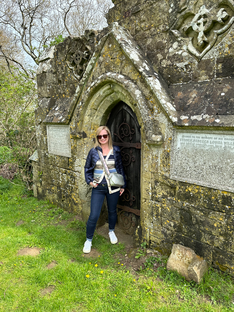 michelle standing in the cemetery at godshill on the isle of wight