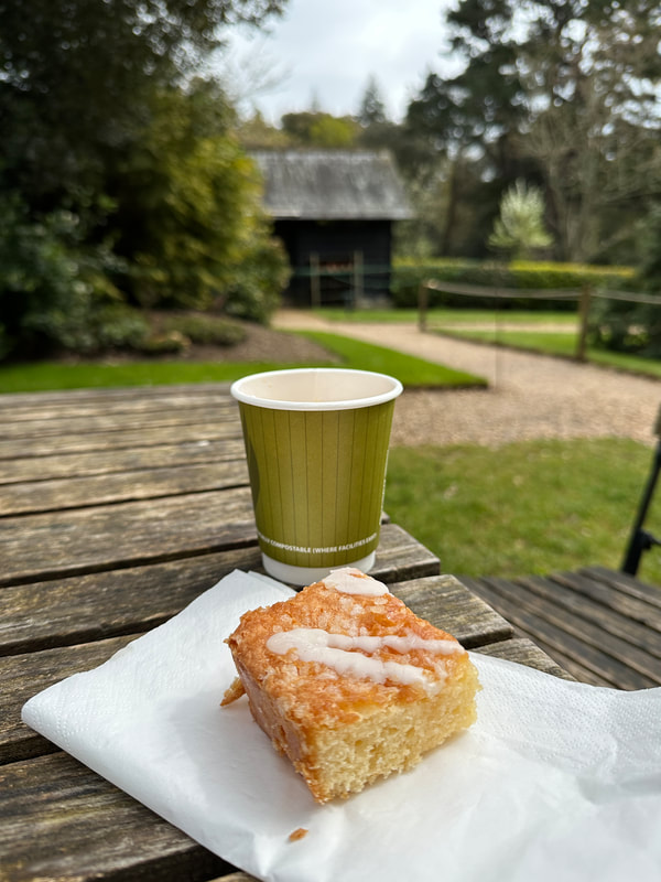 tea and cake on an outside wooden table at osborne house