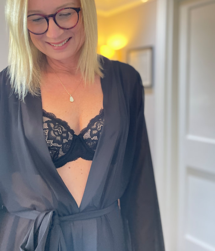 Michelle is in her bedroom wearing Juliemay lingerie with a black sheer gown