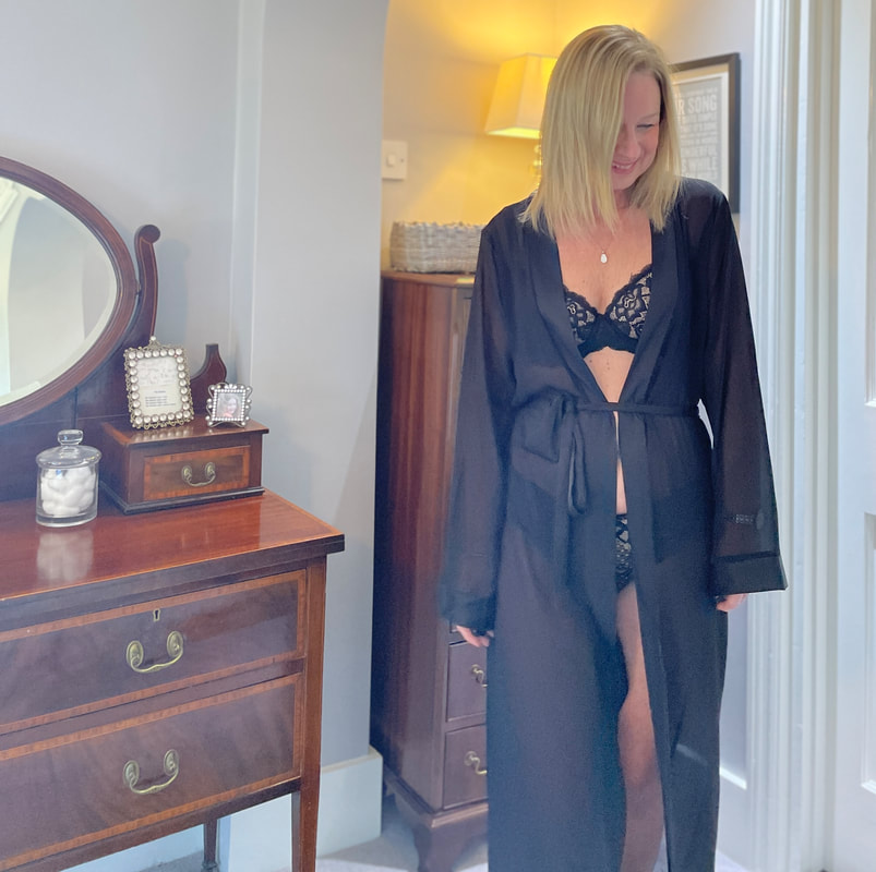 Michelle is in her bedroom wearing Juliemay lingerie with a black sheer gown
