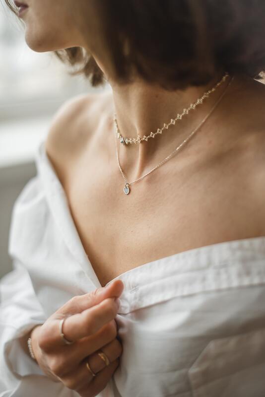 How to style diamonds | woman wearing stacked diamond necklaces with a wedding dress