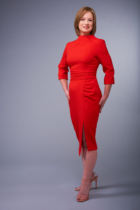 woman in red zara dress modelling for daily mail article