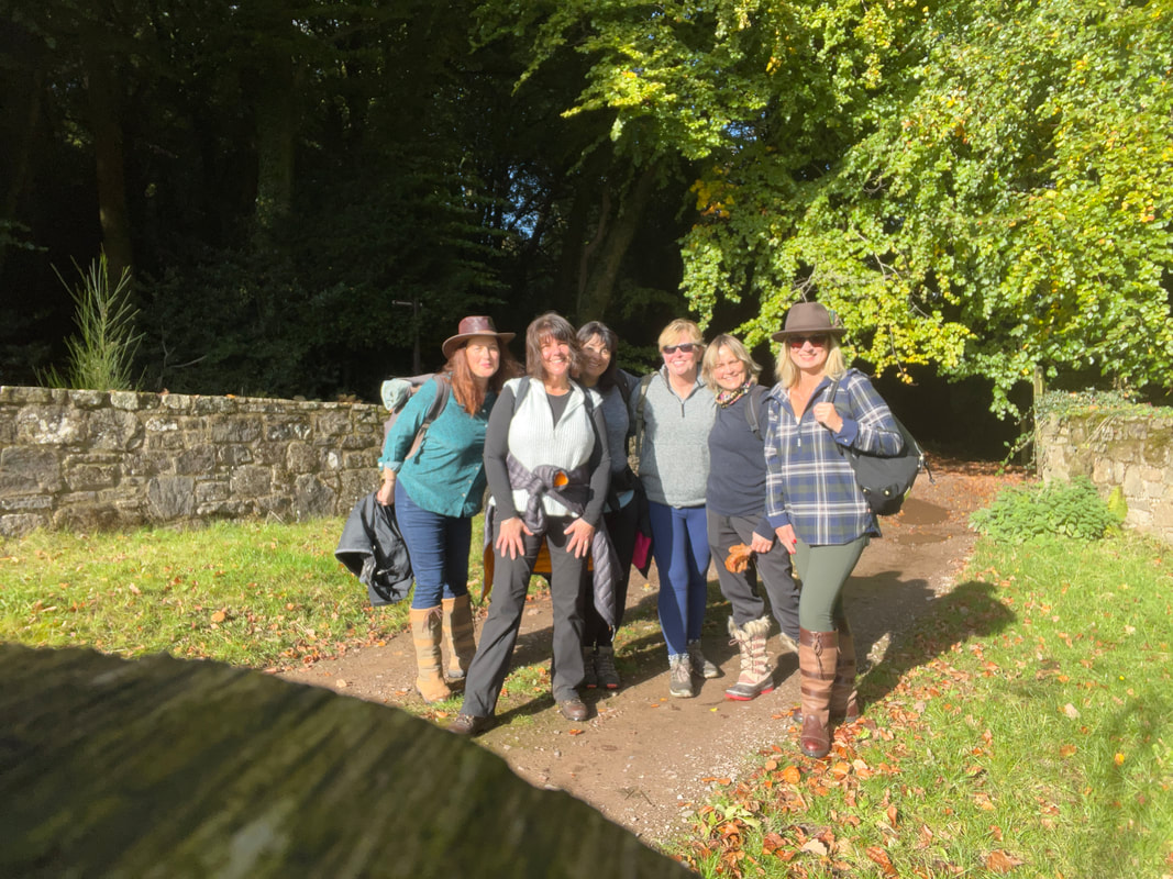 a group of women enjoying a uk writers retreat and forest bathing experience in wales