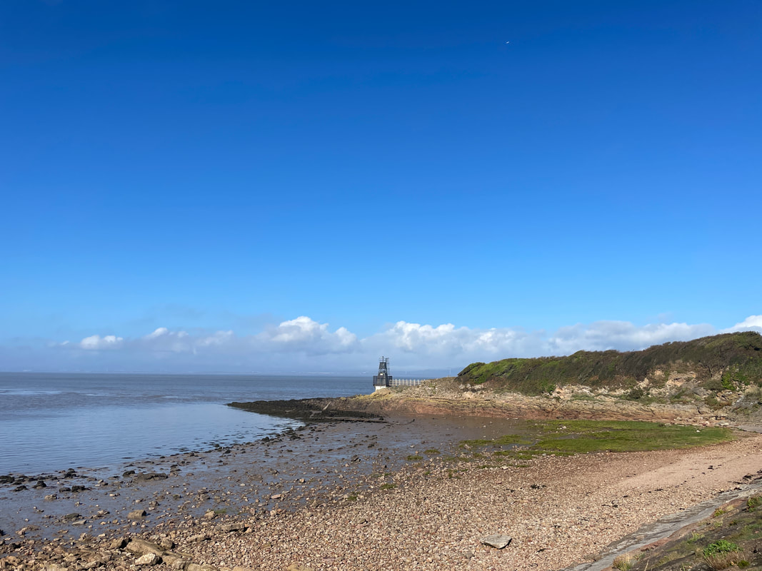 the beach at Portishead with a blue sky
